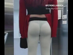 Visible thong booty riding the elevator.