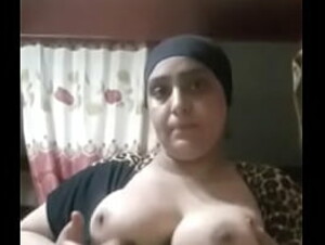 An Egyptian woman is playing with her tits and it is very hot