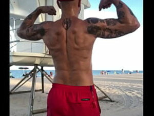 FLEXING BACK AT BEACH