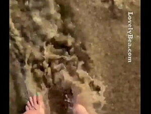 Washing off my beautiful Feet at sandy beach Lovely Bea