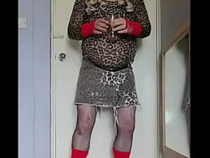 gay crossdresser enjoying the taste of his two glasses of pee that has just come out of his cock