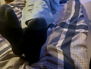 Teen boy feet on bed